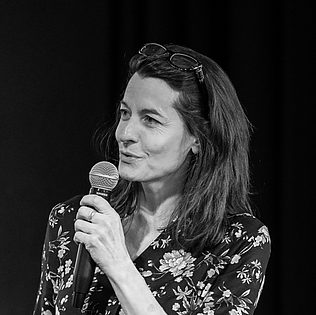 csdommen2019 Caroline Dommen speaking in public with a microphone